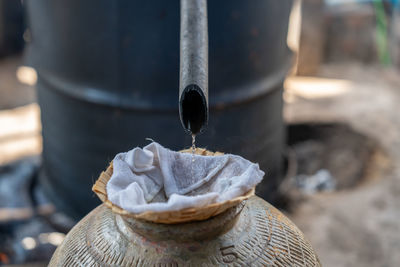 Distillation of laos whisky in a village near luang prabang, laos, south-east asia