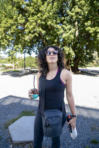 Tourist woman drinking a mate while exploring outdoors.