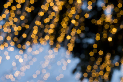 Defocused image of illuminated lights at night