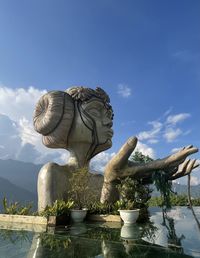 Low angle view of statue against sky