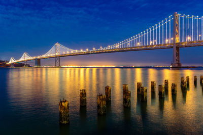 Low angle view of suspension bridge at night