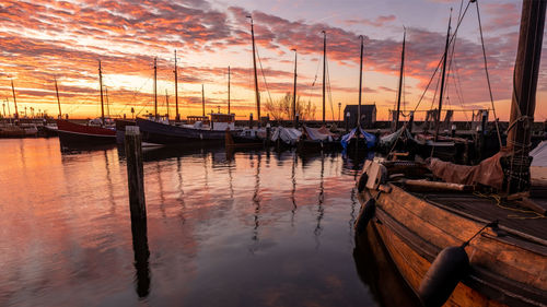 Boats moored at harbor