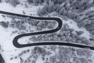 High angle view of snow covered car on field