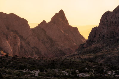 Scenic view of rocky mountains against sky during sunset