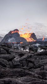 View of bonfire on mountain