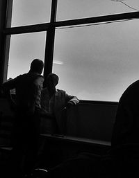 Low angle view of people against sky