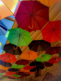 Low angle view of umbrellas hanging on ceiling