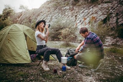 Young couple sitting on smart phone