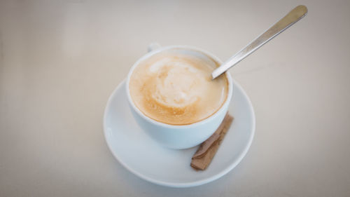 Close-up of cappuccino on table