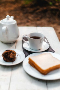 Coffee and cup on table