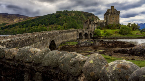 Old castle against cloudy sky