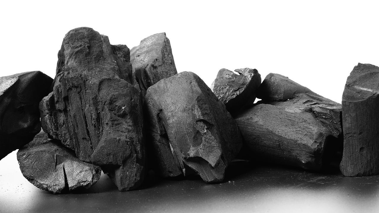 CLOSE-UP OF ROCKS AGAINST WHITE BACKGROUND