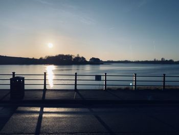 Scenic view of river against sky during sunset