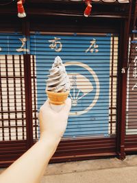 Hand holding ice cream