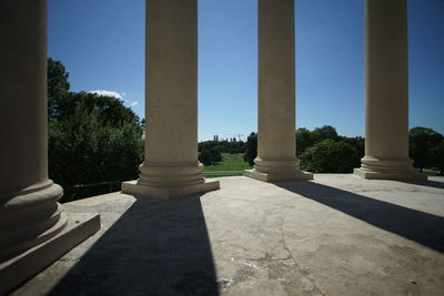 View of colonnade against clear blue sky