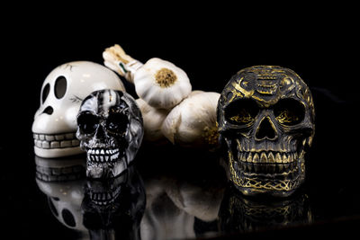 Close-up of human skull against black background