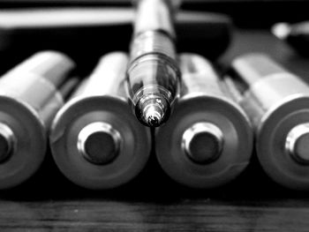 Close-up of pens on table