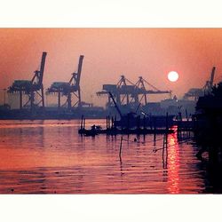 View of harbor at sunset