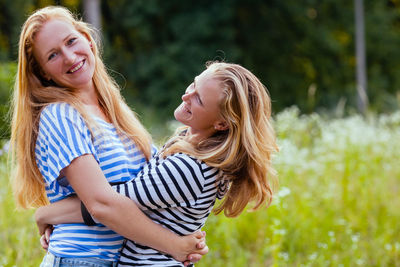 Happy young woman smiling outdoors