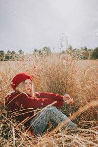 Woman sitting on field