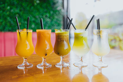 Close-up of wine glasses on table