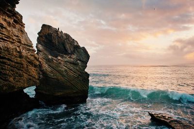 Scenic view of sea against cloudy sky