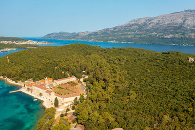 High angle view of swimming pool by sea against sky