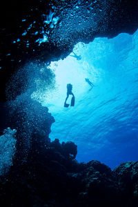 Low angle view of underwater diver swimming in sea0