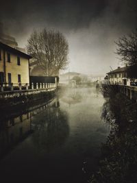Water fountain in swimming pool against sky