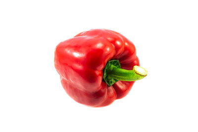 Close-up of red bell peppers against white background