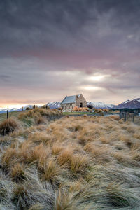 Sunrise view of the church of good shepherd with beautiful snow capped mountain range. 