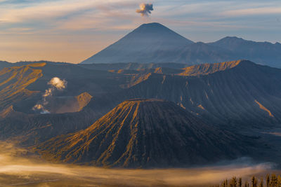 Panoramic view of volcanic landscape against sky during sunset