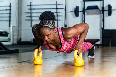 Young woman exercising in gym