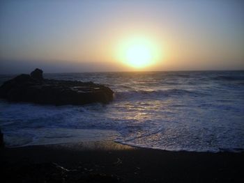 Scenic view of sea at sunset