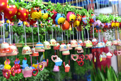 Various fruits hanging for sale at market stall