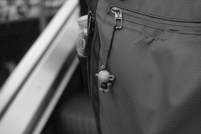 Close-up of man hanging outdoors