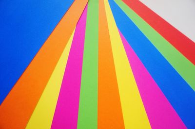High angle view of multi colored papers on gray background