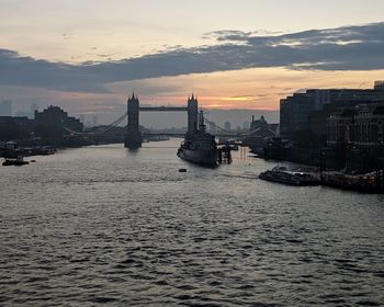 View of city at waterfront during sunset