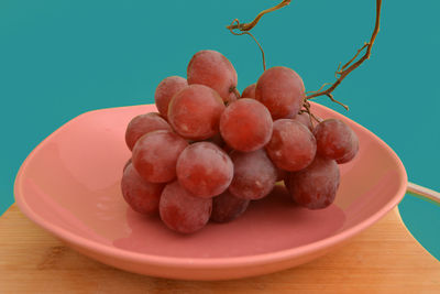 Close-up of fruits in plate on table