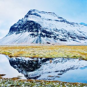 Scenic view of snowcapped mountains against sky