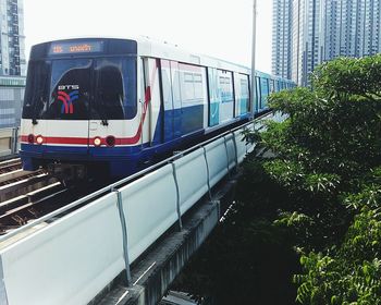 Train on railroad tracks in city