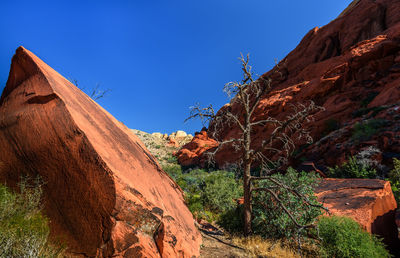 Scenic view of mountains against clear blue sky