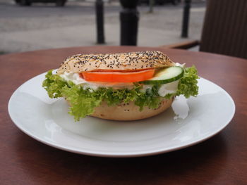 Close-up of sandwich served on table at sidewalk cafe