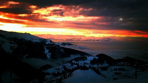 Scenic view of dramatic sky over sea during sunset