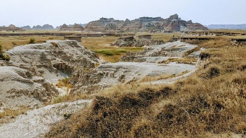 Rock formations on landscape against clear sky