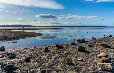 A view of clouds reflection in a tide pool at des moines, washingt6on.