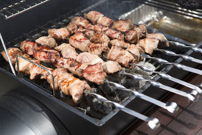 Close-up of meat on barbecue grill