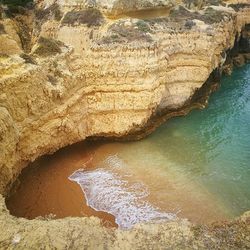 High angle view of rock formations in sea