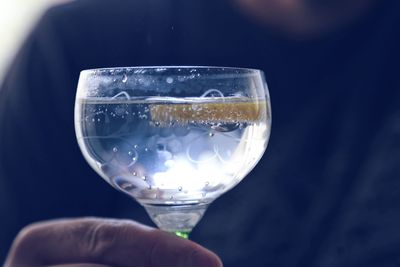 Close-up of hand holding glass of wineglass