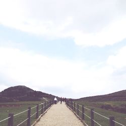 Scenic view of landscape against cloudy sky